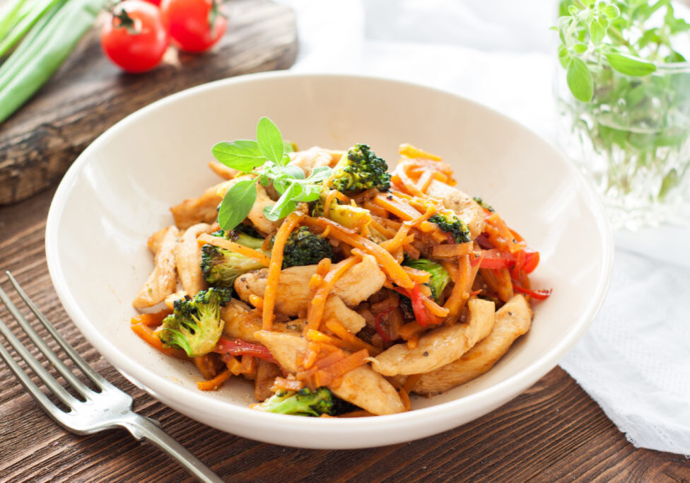 Chicken stir fry with sweet potato noodles, broccoli, carrot and bell pepper